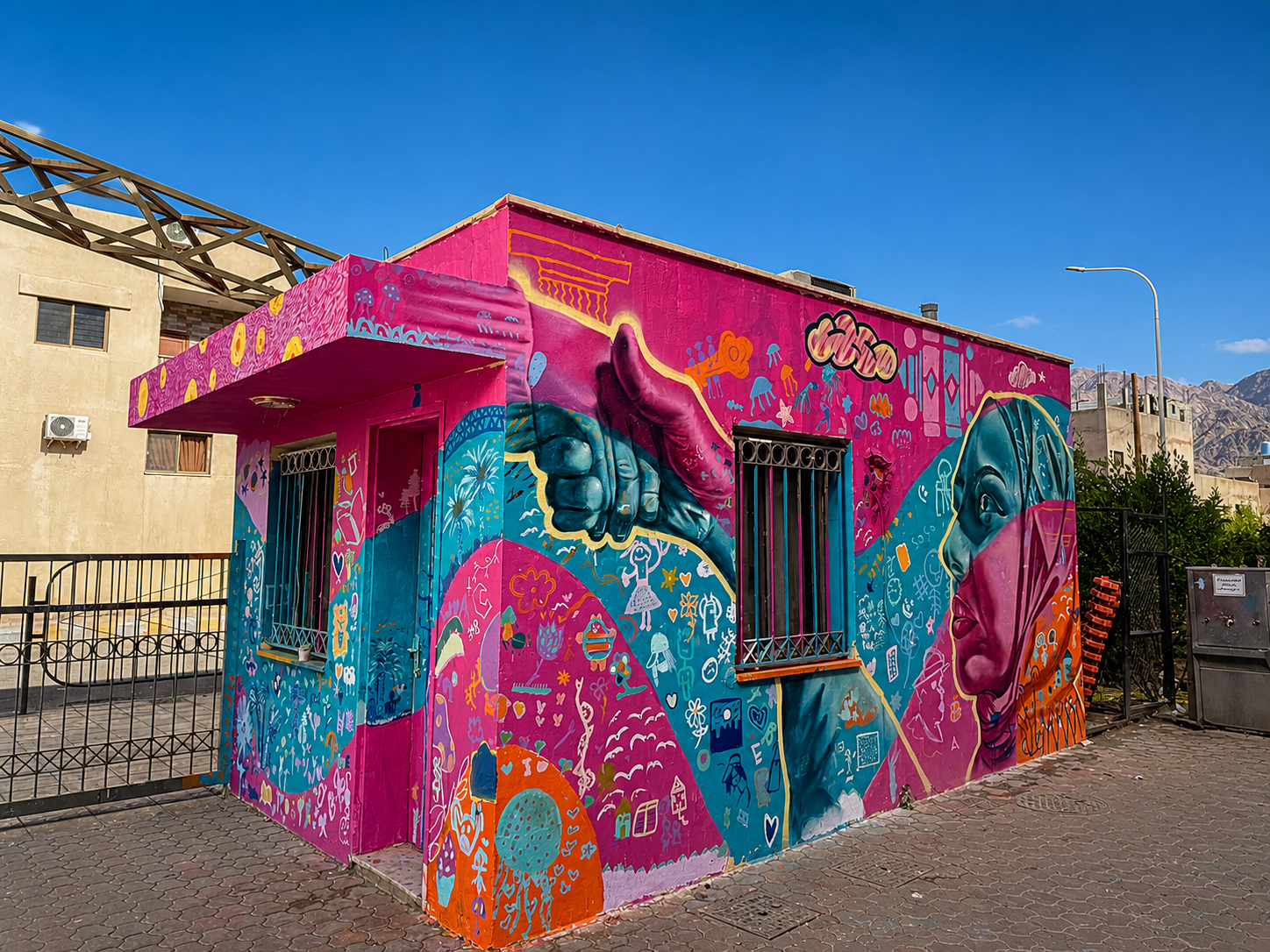 Children with a humanitarian mural